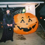 Me in my witch's costume next to the giant pumpkin